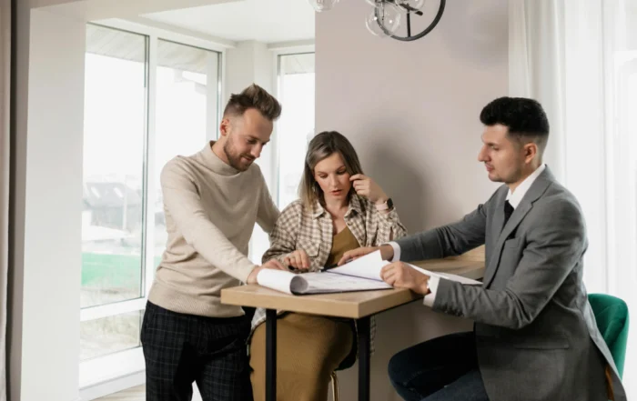 Homeowner reviewing financial documents and requesting mortgage forbearance due to income loss