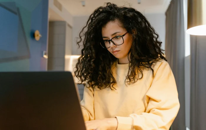 Homeowner reviewing mortgage documents while researching mortgage forbearance options during financial stress