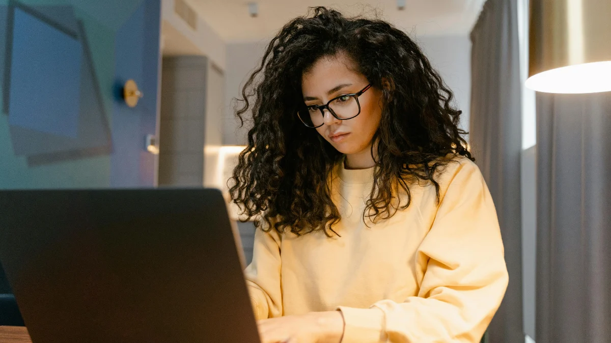 Homeowner reviewing mortgage documents while researching mortgage forbearance options during financial stress