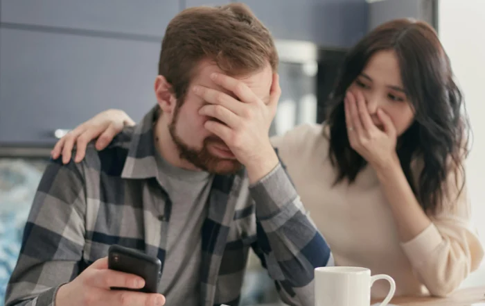 Stressed homeowner looking at bills and exploring mortgage forbearance to manage overwhelming mortgage payments